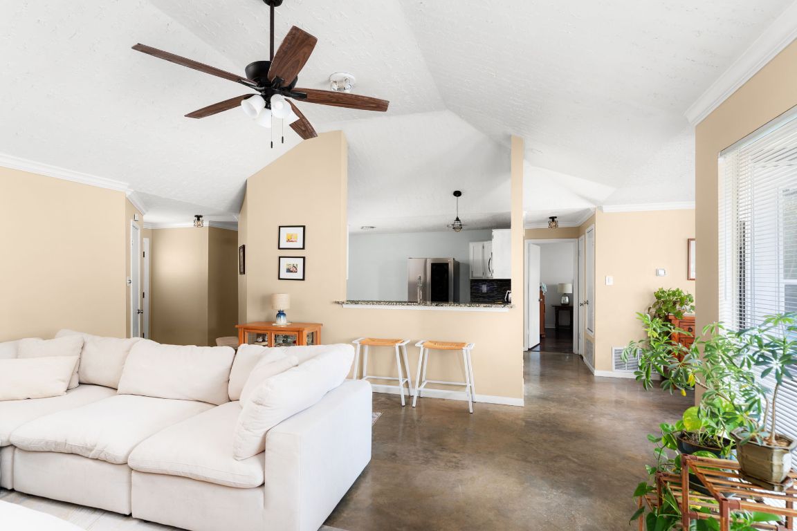 1412 Pigeon Forge Road Pflugerville, TX 78660 - Photo 5 of 20 a living room with furniture and a chandelier