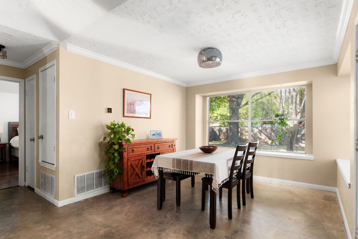 1412 Pigeon Forge Road Pflugerville, TX 78660 - Photo 6 of 20 a view of a dining room with furniture window and outside view