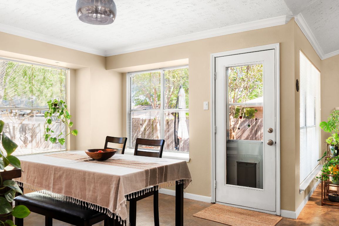 1412 Pigeon Forge Road Pflugerville, TX 78660 - Photo 7 of 20 a view of a dining room with furniture window and outside view