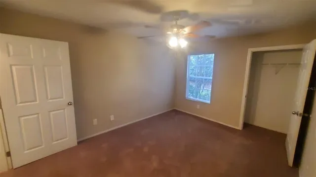 a bathroom with a sink toilet vanity and shower