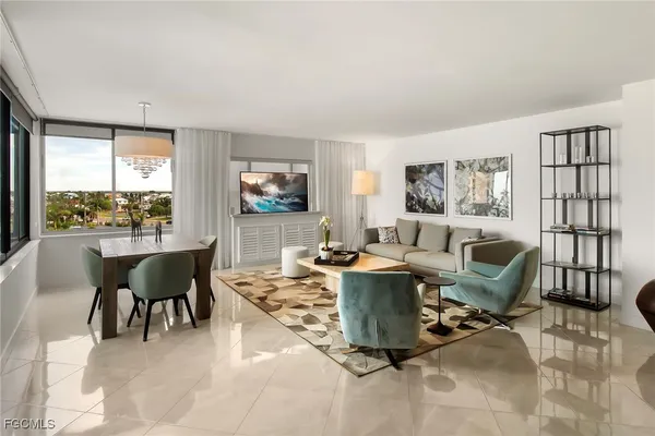 a view of a livingroom with furniture and a table