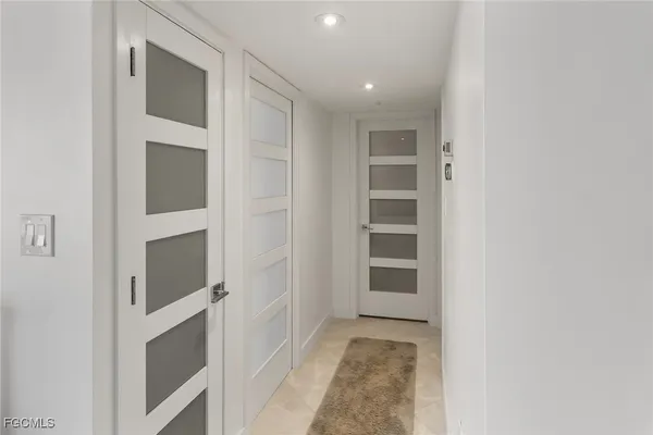 a kitchen with a refrigerator sink and stainless steel appliances