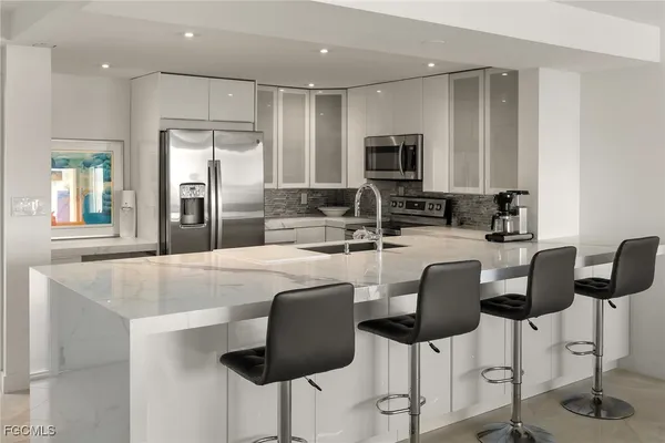 a view of living room with granite countertop furniture and fireplace