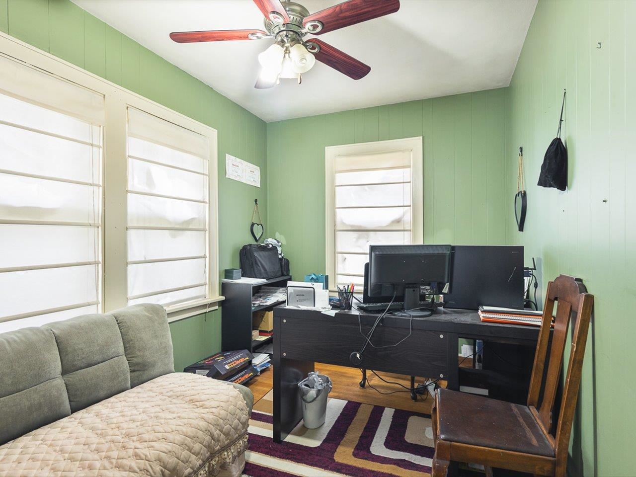 1247 West Logan Street Freeport, IL 61032 - Photo 7 of 34 a view of a livingroom with workspace and a window