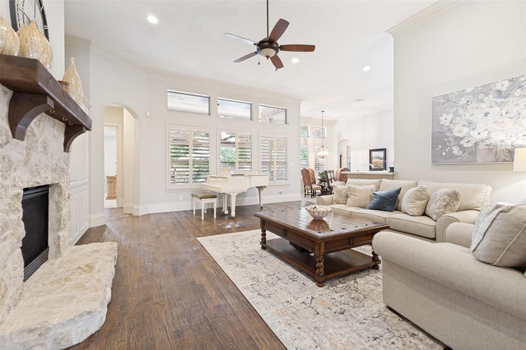 971 Elk Ridge Road Prosper, TX 75078 - Photo 8 of 29 Plantation shutters allowing natural light and showcasing a beautiful backyard view.