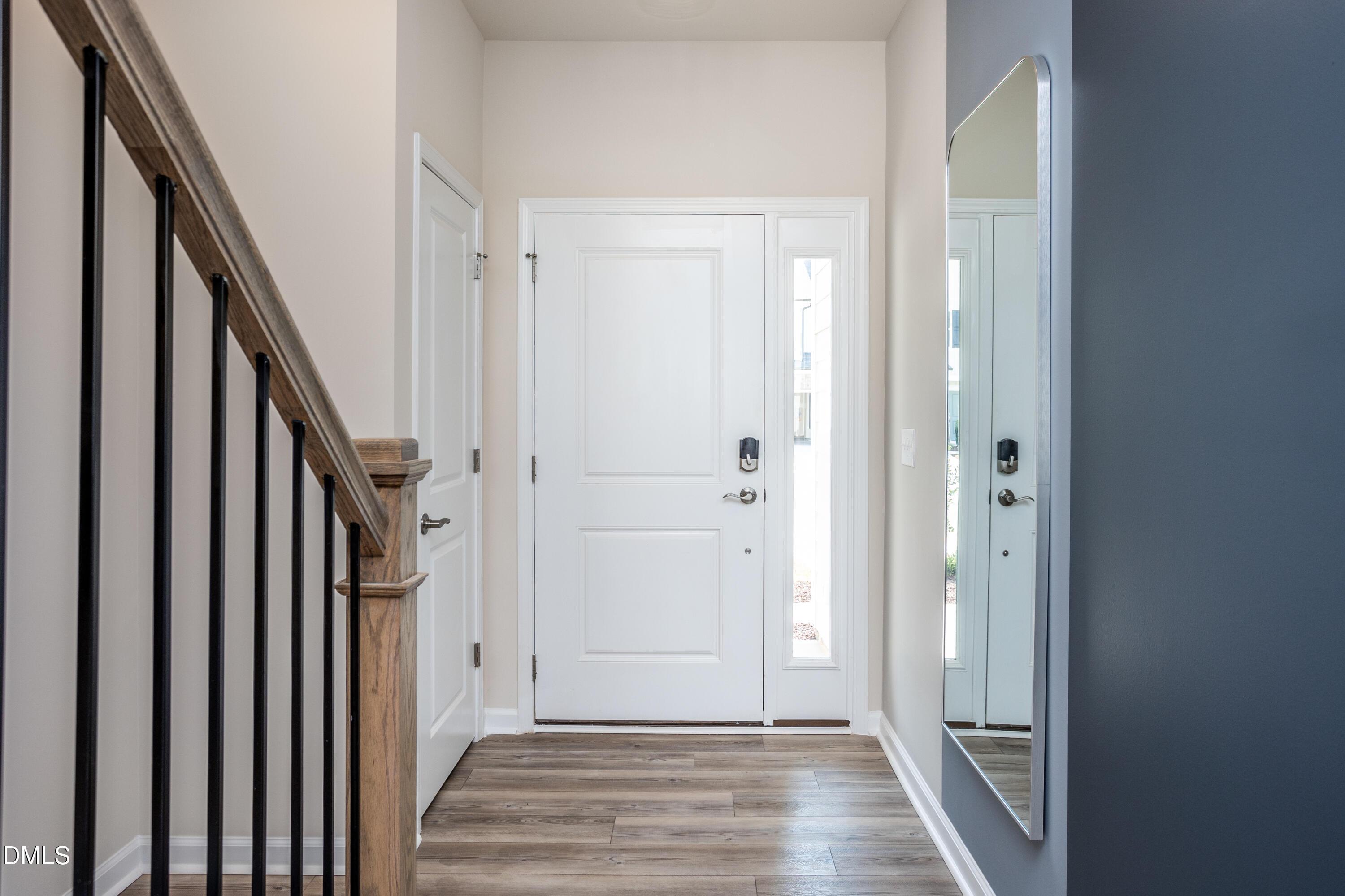 1207 Jensen Road Durham, NC 27703 - Photo 18 of 31 a view of a hallway with wooden floor and staircase