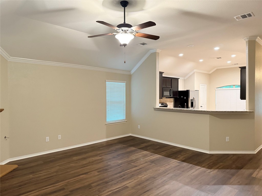 1704 Tranquility Lane Pflugerville, TX 78660 - Photo 11 of 19 a view of an empty room with window and wooden floor