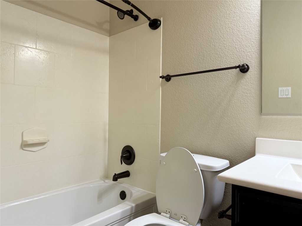 1704 Tranquility Lane Pflugerville, TX 78660 - Photo 4 of 19 a bathroom with a bathtub shower