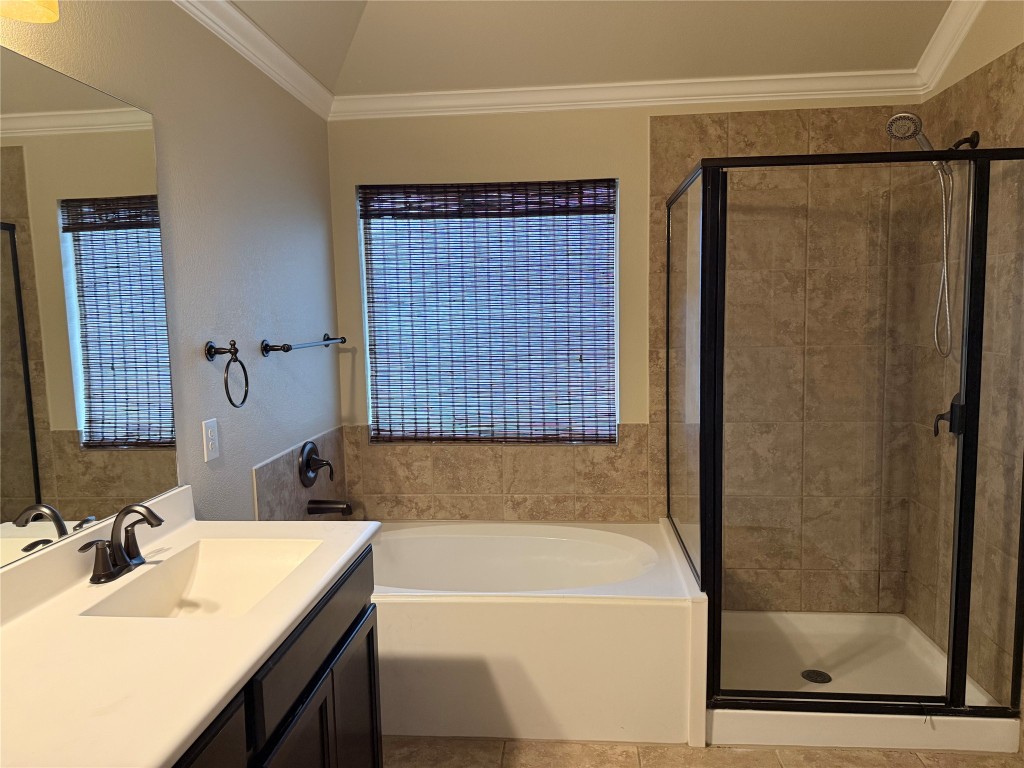 1704 Tranquility Lane Pflugerville, TX 78660 - Photo 7 of 19 a bathroom with a bathtub and a sink