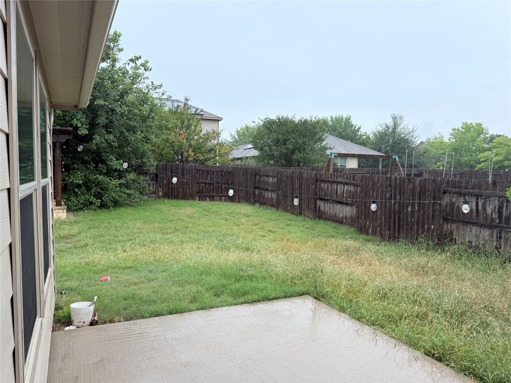 1704 Tranquility Lane Pflugerville, TX 78660 - Photo 10 of 19 a view of a backyard with a garden