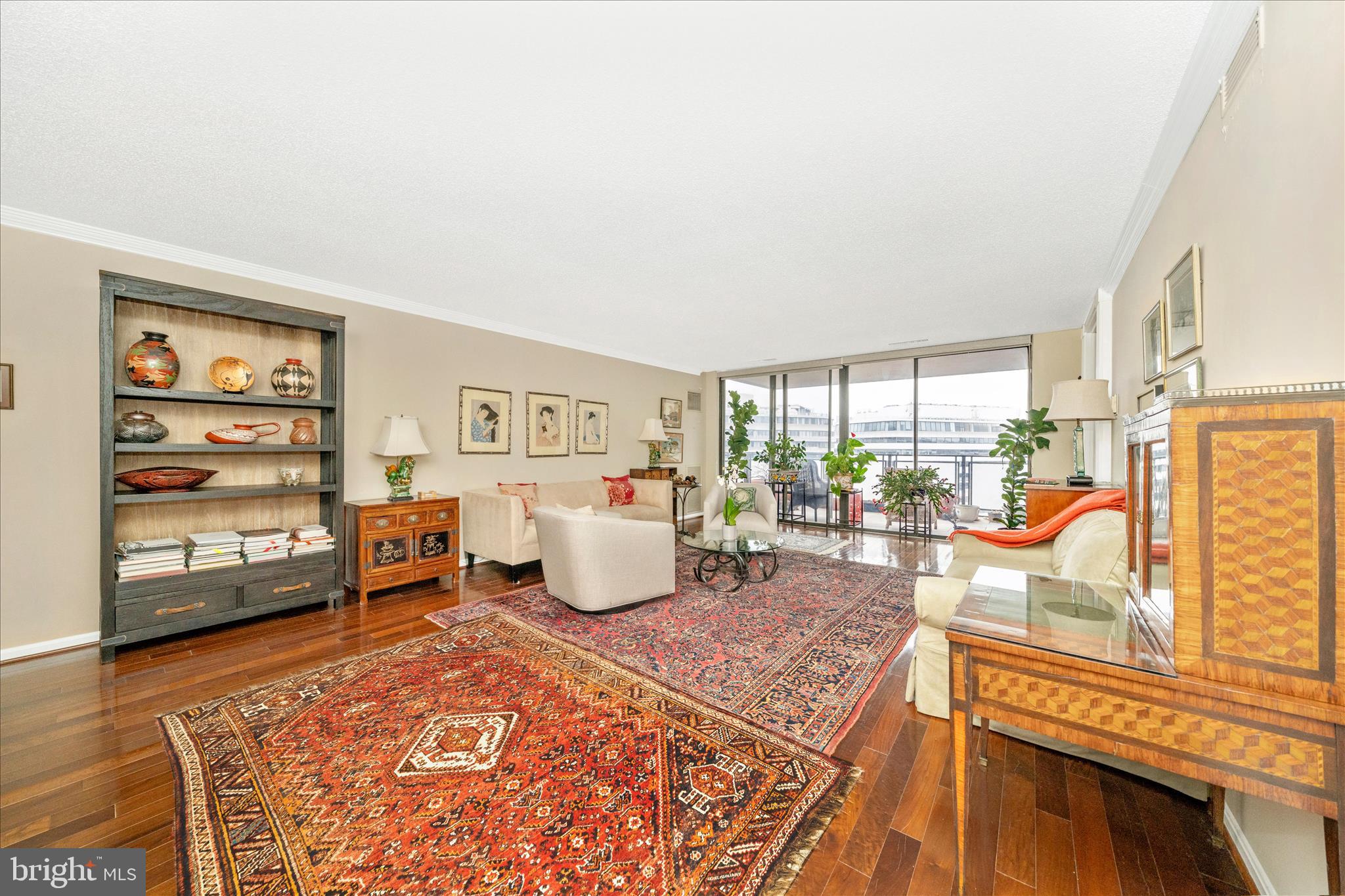 800 25th Street Northwest, Unit 1003 Washington, DC 20037 - Photo 6 of 28 Sun filled living room with balcony.