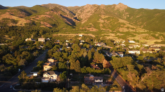 1792 Valley View Drive Layton, UT 84040 - Photo 16 of 18 Residential area featuring varied architectural styles and mature trees, set against a backdrop of mountainous terrain