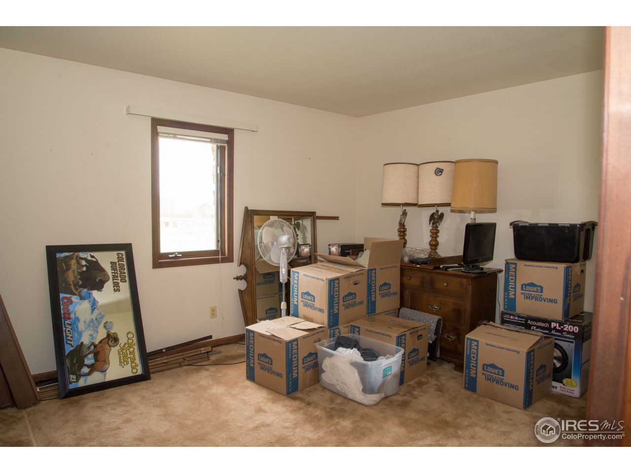 9354 Gunbarrel Ridge Road Boulder, CO 80301 - Photo 15 of 23 a living room with furniture a flat screen tv and a window
