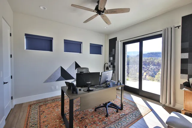 a workspace with furniture and a window