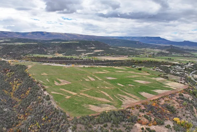 a view of a city with mountains in the background