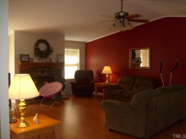 929 Holeman Ashley Road Timberlake, NC 27583 - Photo 3 of 6 a living room with furniture a window and a lamp