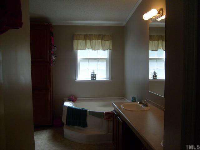 929 Holeman Ashley Road Timberlake, NC 27583 - Photo 5 of 6 a room with a window