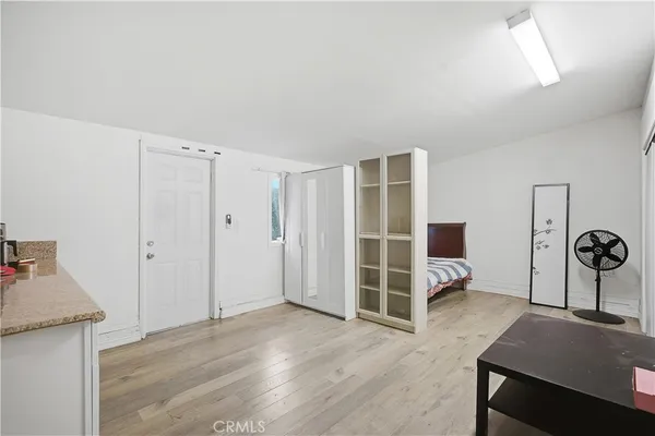 a view of a livingroom with wooden floor