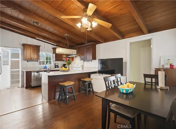 a outdoor dining space with furniture and a kitchen view