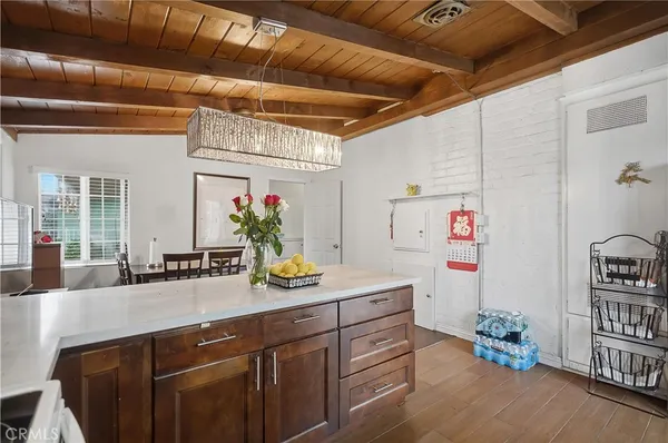 a kitchen with sink and cabinets