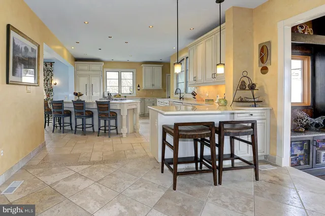 a view of a livingroom with workspace and a window