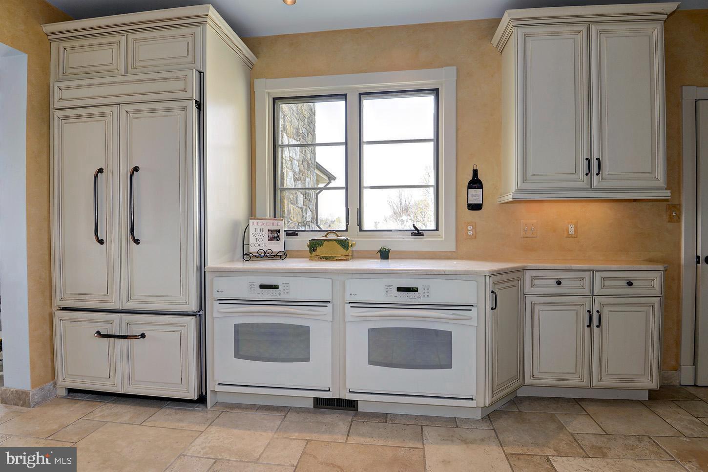16704 Thurston Road Dickerson, MD 20842 - Photo 35 of 101 a kitchen with white cabinets and white appliances