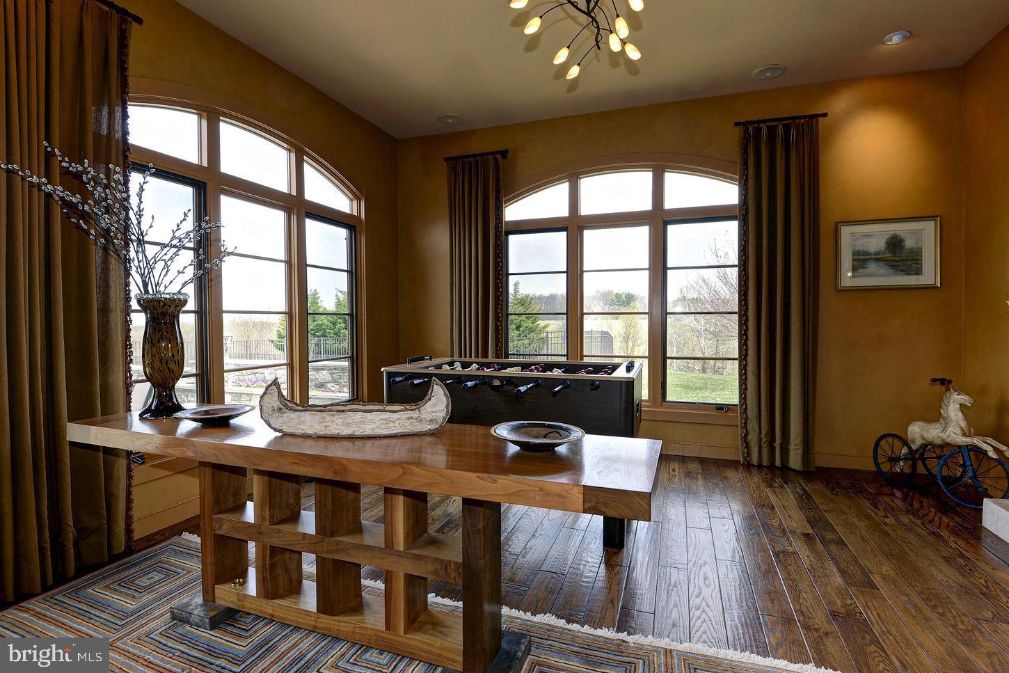 16704 Thurston Road Dickerson, MD 20842 - Photo 44 of 101 a view of a dining room with furniture large windows and wooden floor