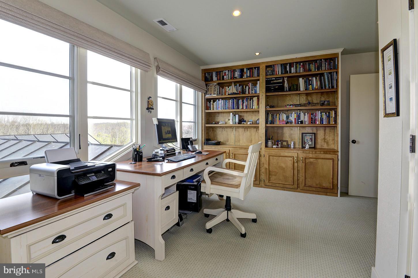 16704 Thurston Road Dickerson, MD 20842 - Photo 56 of 101 a view of a workspace with furniture and a large window