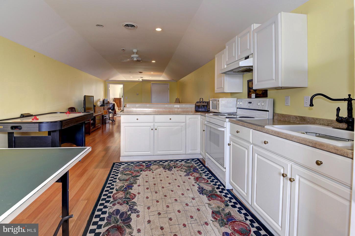 16704 Thurston Road Dickerson, MD 20842 - Photo 67 of 101 a kitchen with a sink stove and cabinets