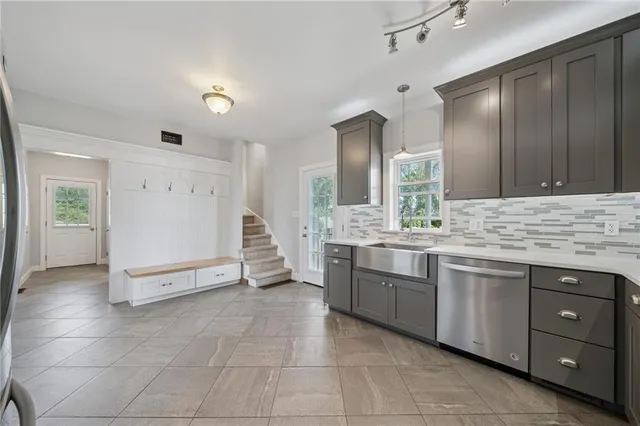 a view of a kitchen sink and a window