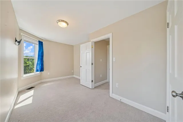 a bathroom with a double vanity sink toilet and shower