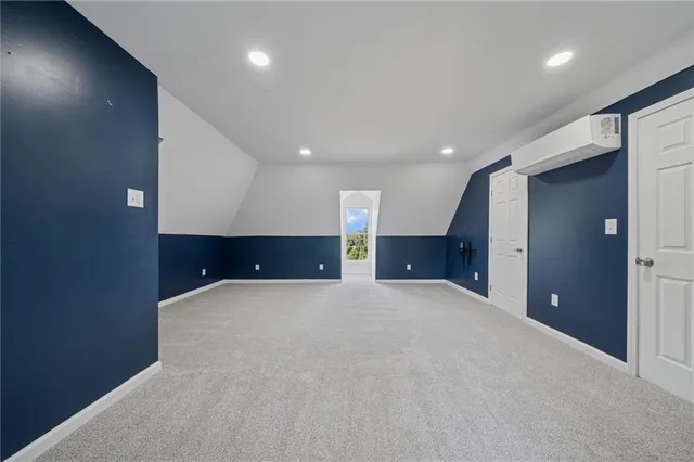 a view of a livingroom with a ceiling fan and entryway