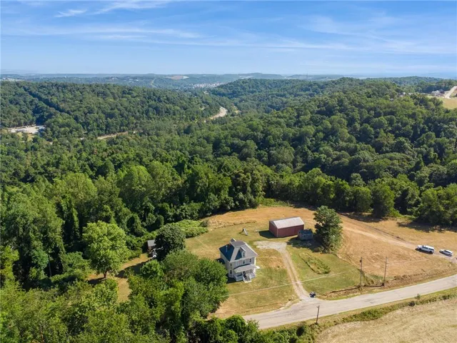 a large kitchen with a stove a sink and a refrigerator