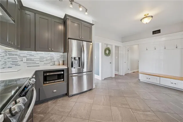a bathroom with a sink a vanity and a large mirror