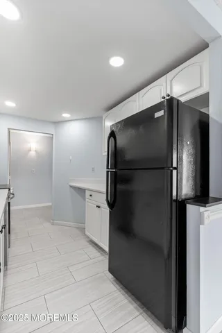 a bathroom with a shower and a mirror