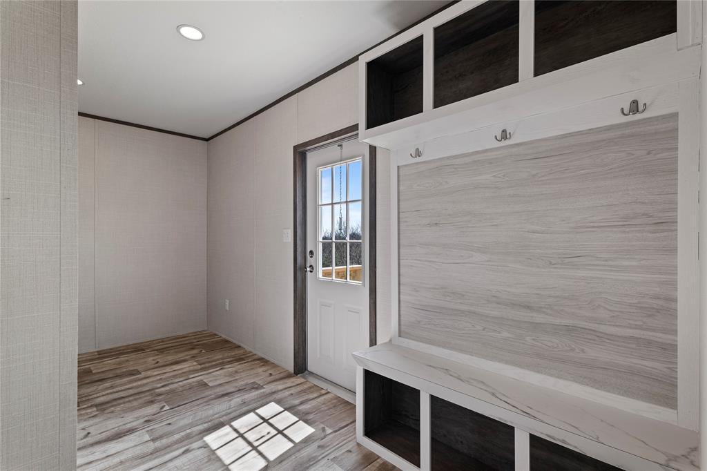 3924 Sandusky Road Whitesboro, TX 76273 - Photo 19 of 22 Mudroom featuring light wood-style floors, ornamental molding, and recessed lighting