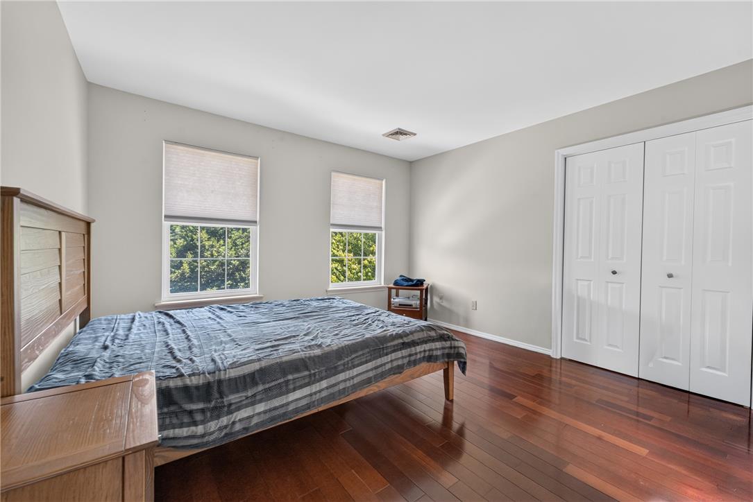 220 Pennbrook Road Stroudsburg, PA 18360 - Photo 32 of 60 Rich hardwood flooring creates a warm foundation for this airy bedroom space.