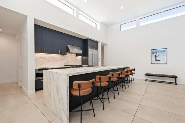 a dining hall with a dining table and chairs
