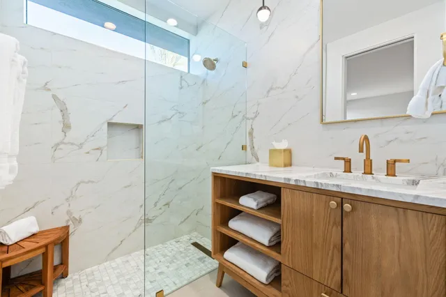 a view of a patio with dining table and chairs