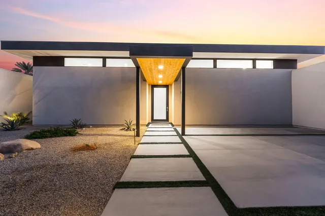 a view of swimming pool with large windows