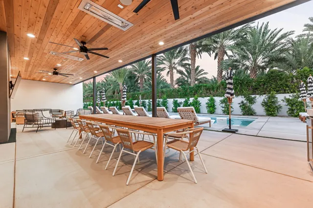 a view of a swimming pool with a lounge chairs