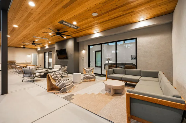 a view of a patio with swimming pool table and chairs