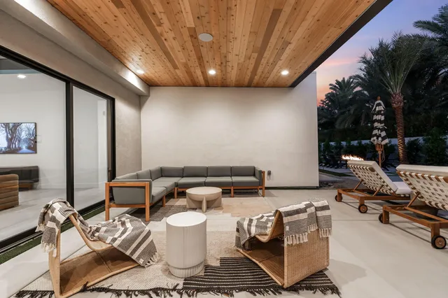 a view of swimming pool with outdoor seating