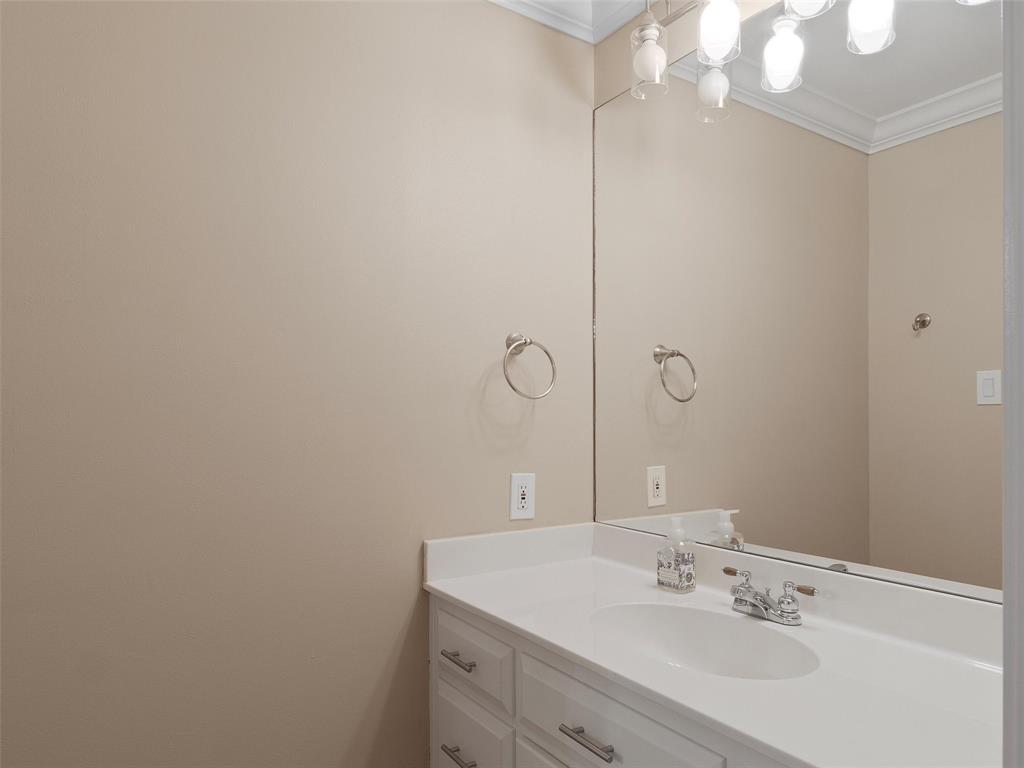1103 Marigold Lane Longview, TX 75604 - Photo 28 of 34 a bathroom with a sink vanity and a mirror