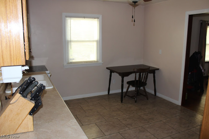 39199 Parsons Road Grafton, OH 44044 - Photo 4 of 25 Another view of the kitchen leading into the living room. There is a pass-thru window near the sink to what could be the dining room/sunroom.
