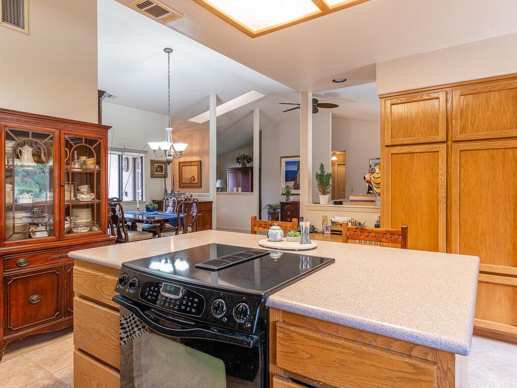 2715 Thoroughbred Place Arroyo Grande, CA 93420 - Photo 11 of 35 a kitchen with a stove a sink and a refrigerator