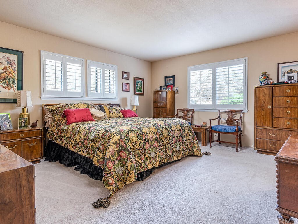 2715 Thoroughbred Place Arroyo Grande, CA 93420 - Photo 13 of 35 a bed sitting in a bedroom next to a window