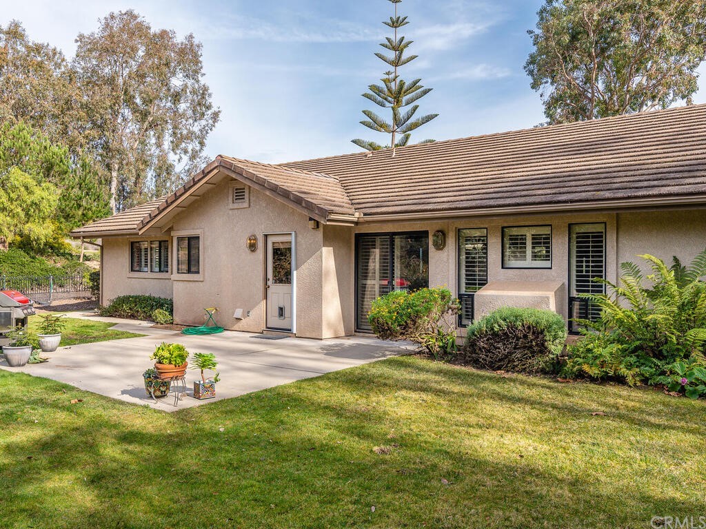 2715 Thoroughbred Place Arroyo Grande, CA 93420 - Photo 23 of 35 a view of a house with backyard and sitting area