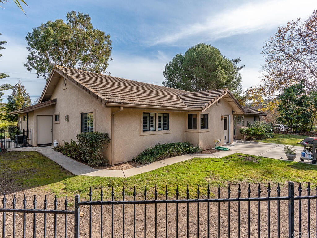 2715 Thoroughbred Place Arroyo Grande, CA 93420 - Photo 26 of 35 a view of a house with a yard and lawn chairs with a fire pit