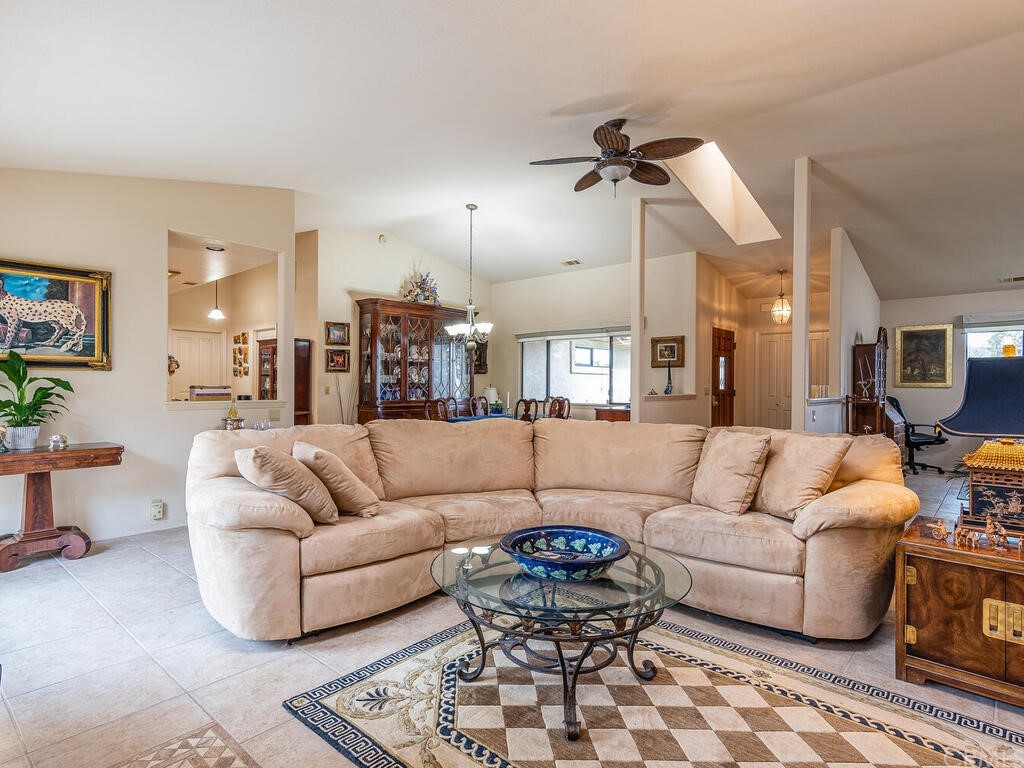 2715 Thoroughbred Place Arroyo Grande, CA 93420 - Photo 6 of 35 a living room with furniture and a dining table with wooden floor
